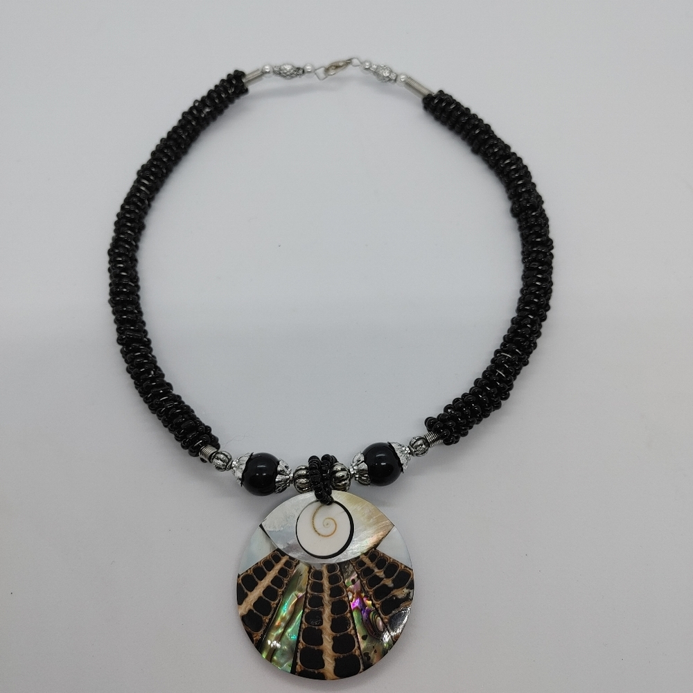 Necklace with abalone shell details